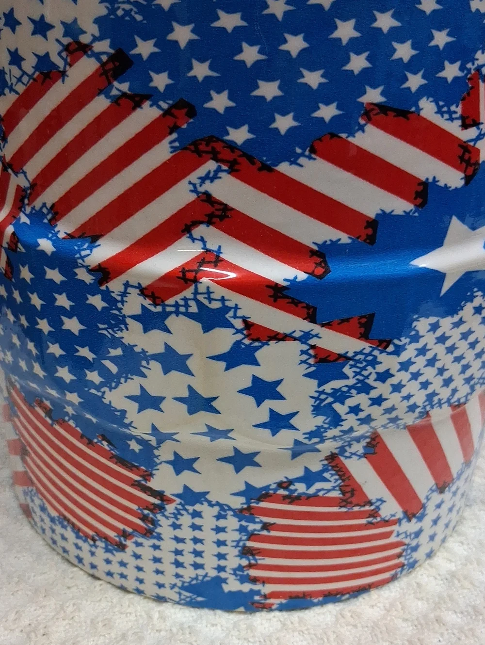 Patriotic Mr. Ice Bucket features a vibrant USA flag pattern& sturdy blue handle